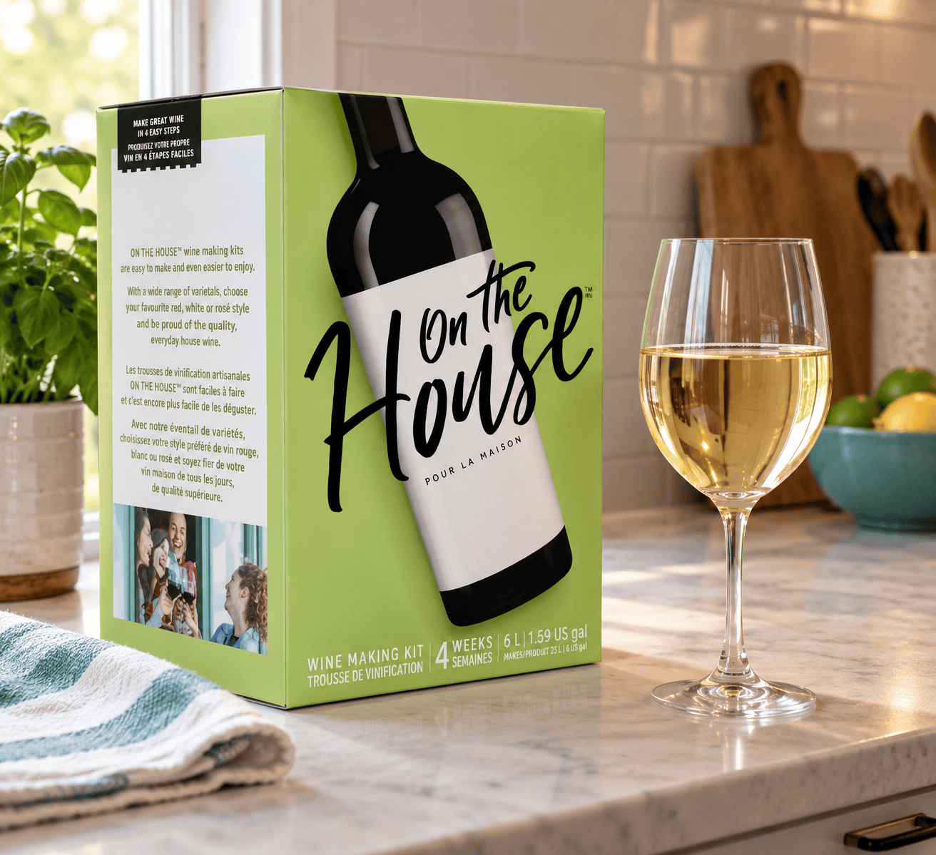 On the House California 4-week wine kit box next to a glass of white wine on a marble kitchen counter