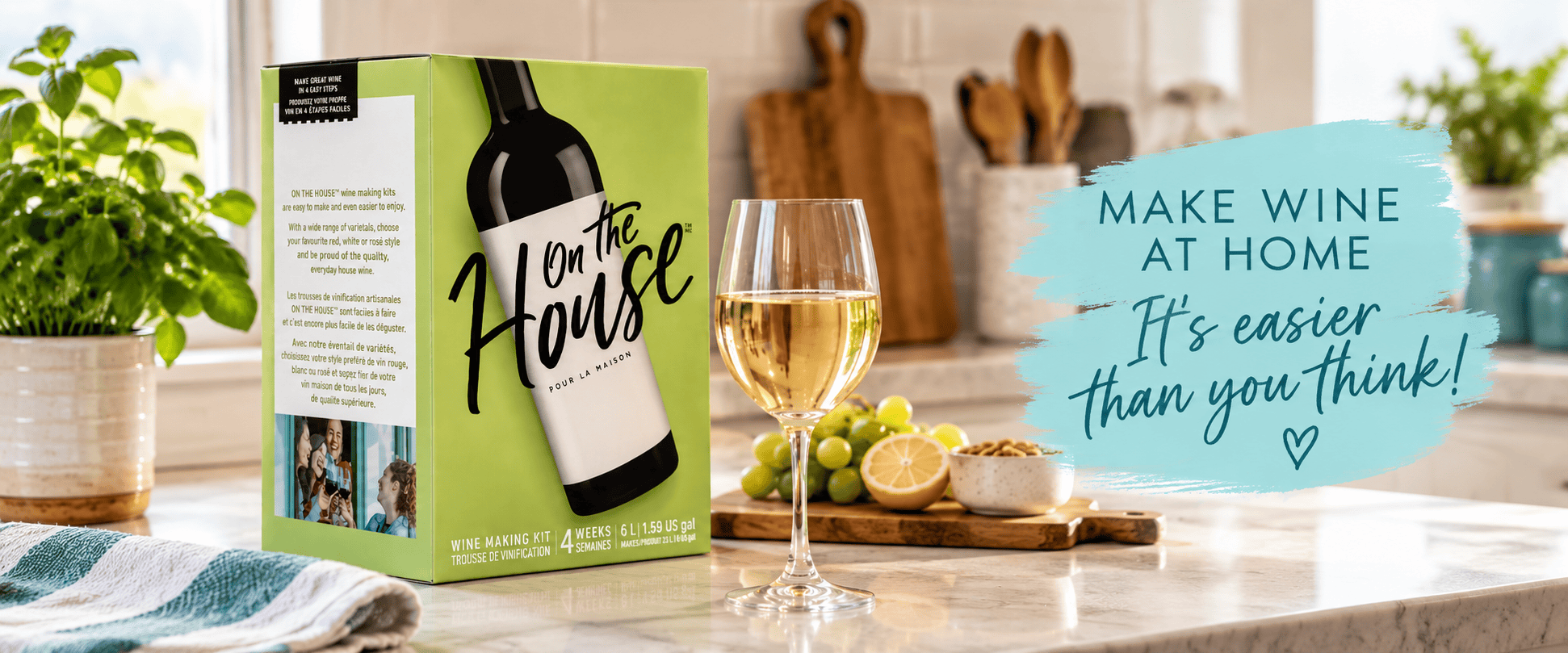 On the House 4-week California wine making kit beside a glass of white wine on a kitchen counter, with the words make wine at home, it's easier than you think