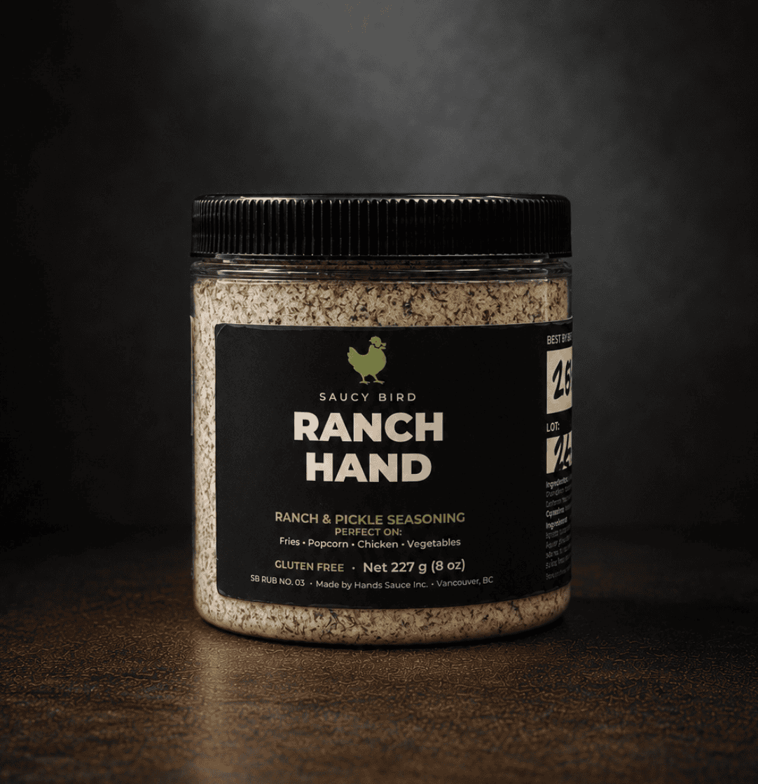 Jar of Saucy Bird Ranch Hand ranch and pickle seasoning, 227 g, on a dark background