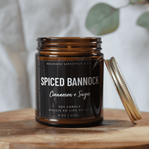 Mashkiki Spiced Bannock 8 oz amber glass soy candle in Cinnamon + Sugar with a gold metal lid