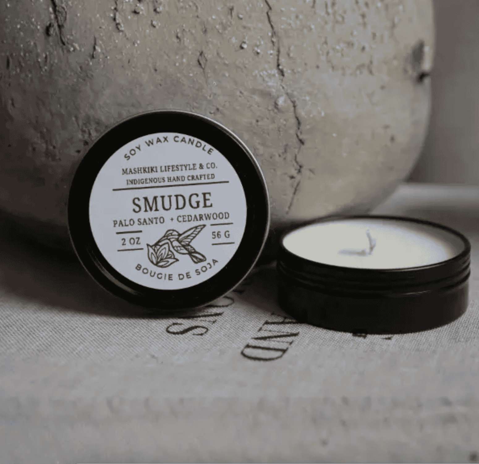 Mashkiki Smudge 2 oz soy wax candle tin in Palo Santo + Cedarwood, lid off