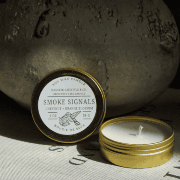 Mashkiki Smoke Signals 2 oz soy candle in a gold tin, Chestnut + Orange Blossom, lid off