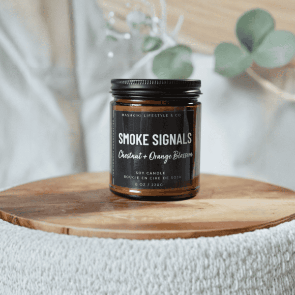 Mashkiki Smoke Signals 8 oz amber glass soy candle, Chestnut + Orange Blossom, with a matte black lid