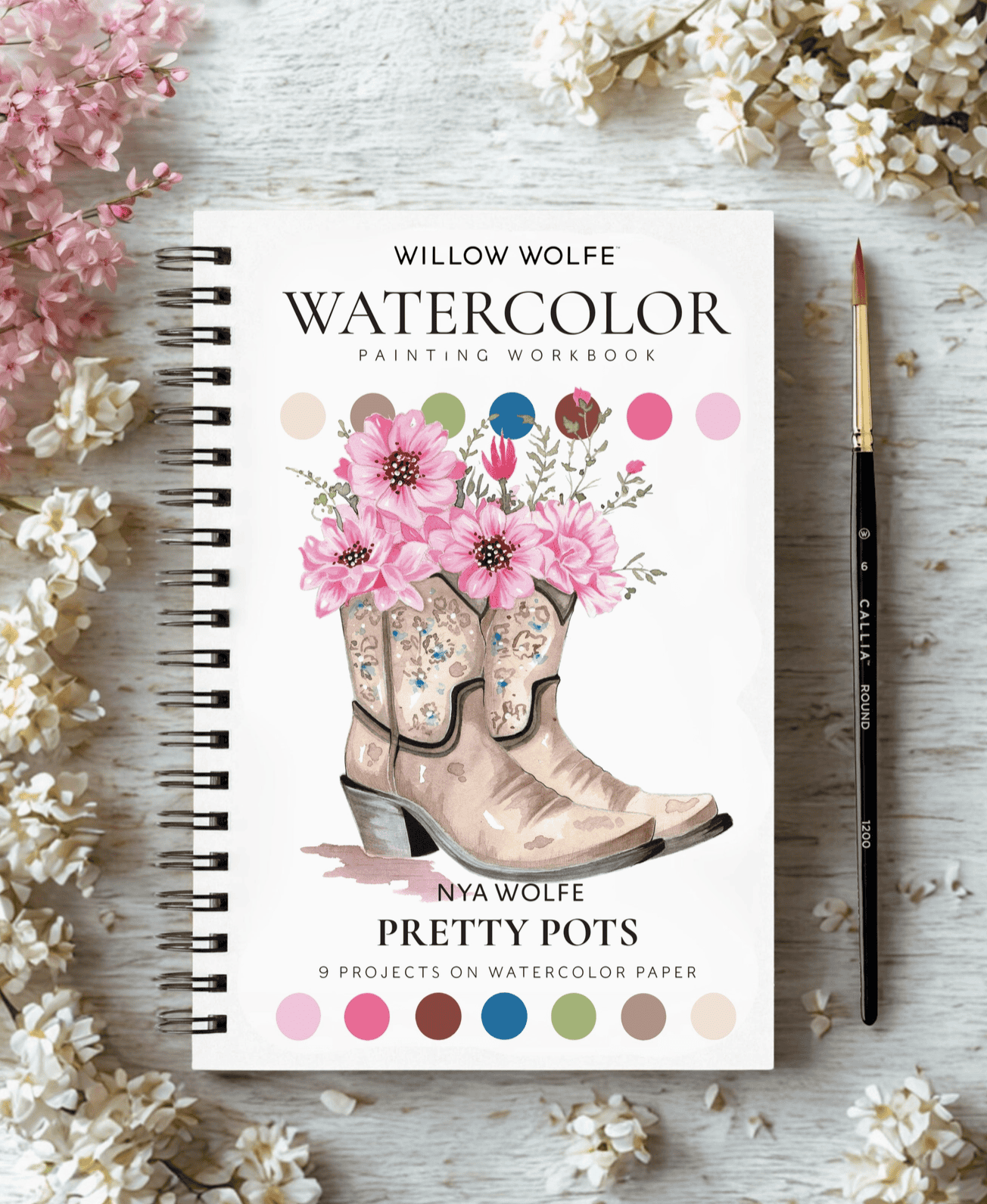 Pretty Pots watercolour workbook front cover styled with spring blossoms and a Callia round brush